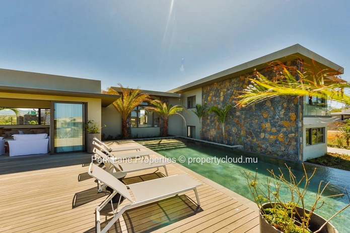Bohemian Villa with Lagoon & Mountain Views for sale at Beau Champ.
