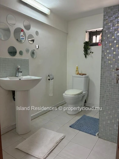 2 BR ground floor apartment with a private courtyard and parking space