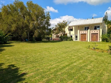Elegant architect-designed villa with wooden floors, double garage, on a beautiful one-acre property with a magnifice...
