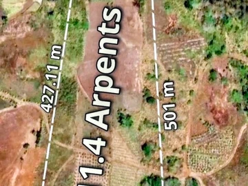 Expansive 12-Acre Agricultural Land in Quatre Soeurs with Stunning Views