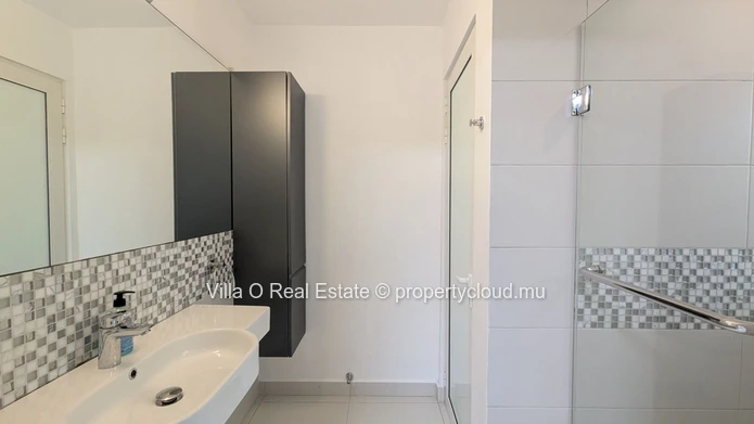 Nestled in the heart of Floreal, this architectural gem offers a modern lifestyle with an omnipresent nature that ill... (Sole Mandate)