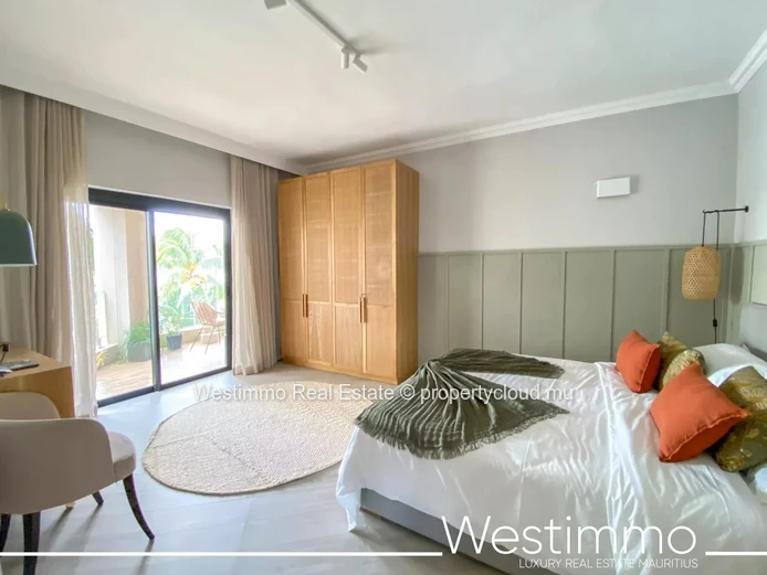 Flic en Flac - Luxueux appartement pieds dans l'eau avec piscine et vue sur le lagon.