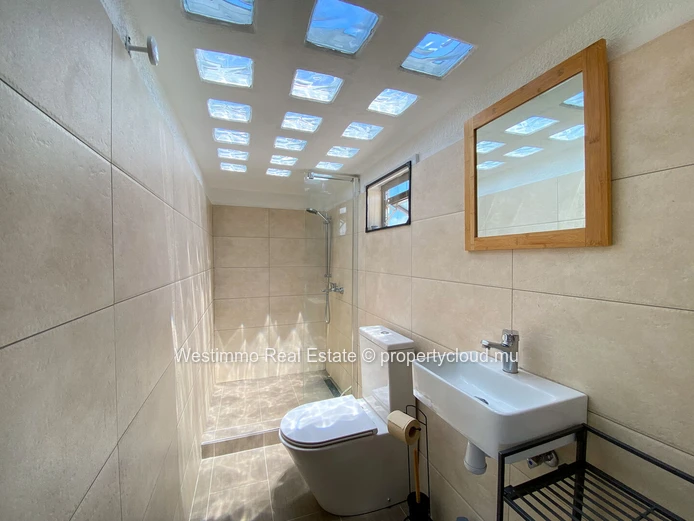 Long-term rental: Furnished studio with terrace and sea view for rent in Grand Gaube, Mauritius.