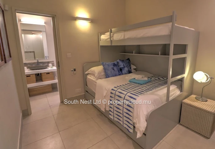 Modern 3-bed apartment with garden and private access to the beach of Pointe d'Esny.  