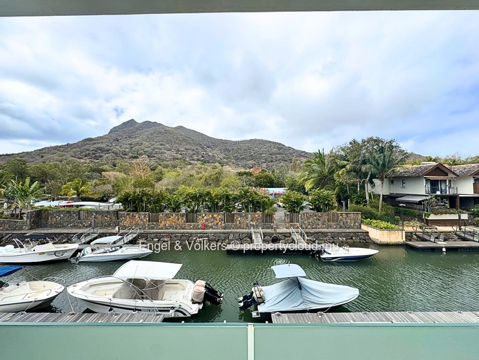 Exceptional Three-Bedroom Apartment with Panoramic Marina and Mountain Views