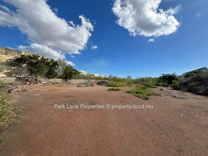 Expansive 8,847 m² Secured Plot with Building and Asphalted Area