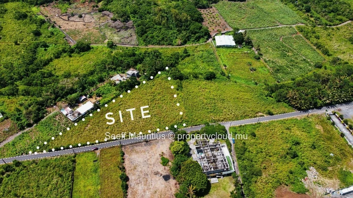 Golden Opportunity: Large Plot with Stunning Mountain and Sea Views, on the main road.