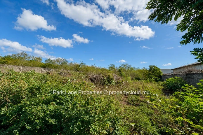 Expansive 8,847 m² Secured Plot with Building and Asphalted Area