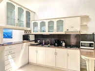 La Gaulette for sale villa divided into 4 two-bedroom apartments with commun swimming pool in a quiet residential area.