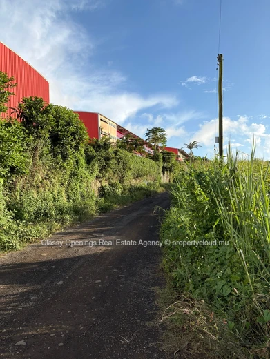 Prime 4,200m² Commercial Plot in Petit Camp — Mountain Views & Near Bus