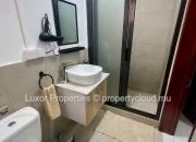 Profitez d’une vie moderne et confortable dans cet appartement lumineux au rez-de-chaussée à Flic en Flac.