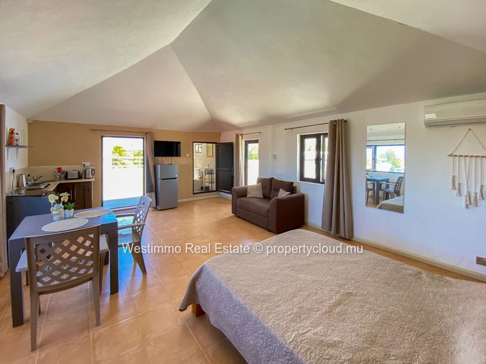 Long-term rental: Furnished studio with terrace and sea view for rent in Grand Gaube, Mauritius.