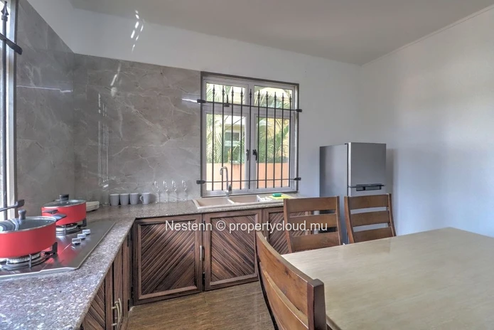 Spacious traditional triplex apartment in Grand Baie with 2 bedrooms, furnished, air conditioning, veranda, and close...