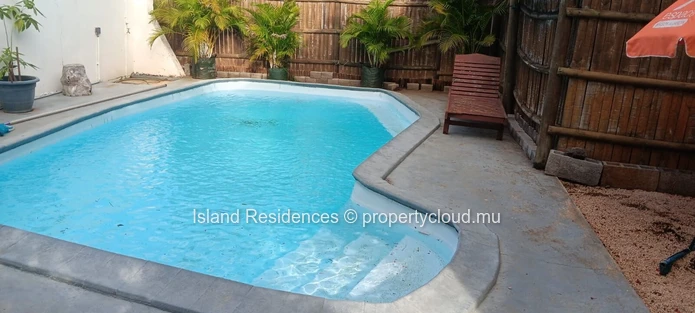 3 bedroom house with a pool and parking space in a quiet residential area in the heart of Trou aux Biches