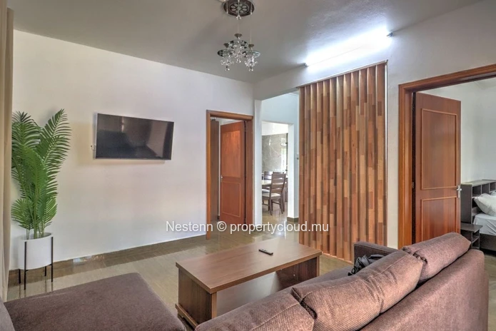 Spacious traditional triplex apartment in Grand Baie with 2 bedrooms, furnished, air conditioning, veranda, and close...