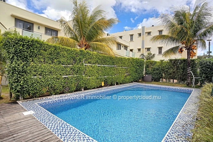 Duplex in residence with communal swimming pool