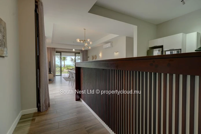 Elegant beachfront 3-bedroom apartment with private garden & direct beach access. 