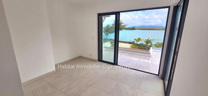 This stunning unfurnished beachfront villa of 300 m² nestled within an intimate and secure residence