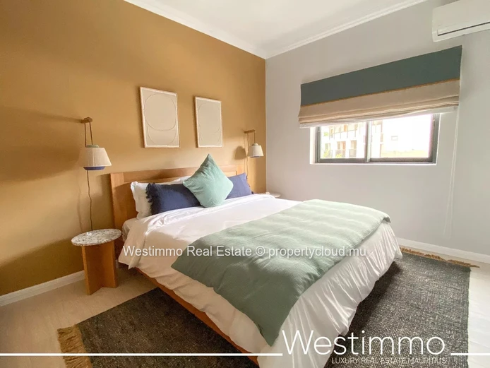 Flic en Flac - Luxueux appartement pieds dans l'eau avec piscine et vue sur le lagon.