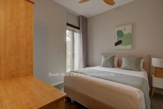 Elegant beachfront 3-bedroom apartment with private garden & direct beach access. 