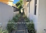Située dans un quartier résidentiel paisible de Flic en Flac