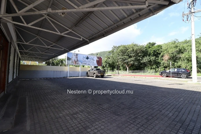 Commercial building with sea and mountain views.