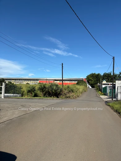 Prime 4,200m² Commercial Plot in Petit Camp — Mountain Views & Near Bus