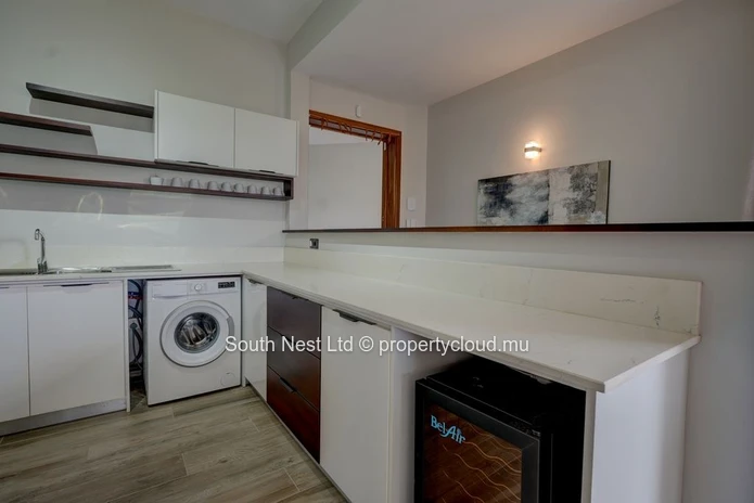 Elegant beachfront 3-bedroom apartment with private garden & direct beach access. 
