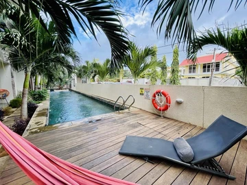 "Modern Furnished Apartment in Flic en Flac with Communal Pool - 103m² Living Space - Rs 50,000/month"