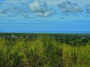 Golden Opportunity: Large Plot with Stunning Mountain and Sea Views, on the main road.