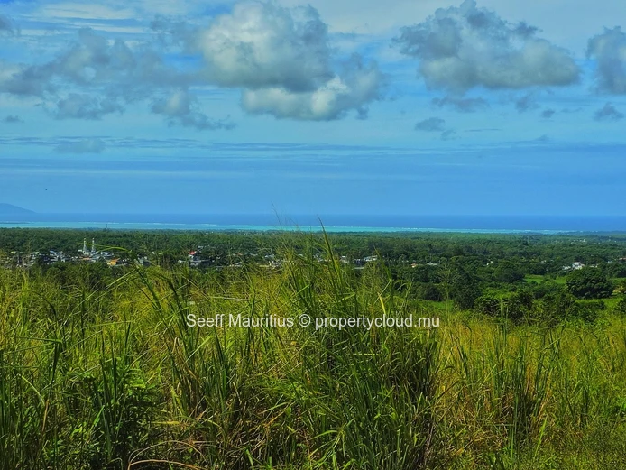 Golden Opportunity: Large Plot with Stunning Mountain and Sea Views, on the main road.