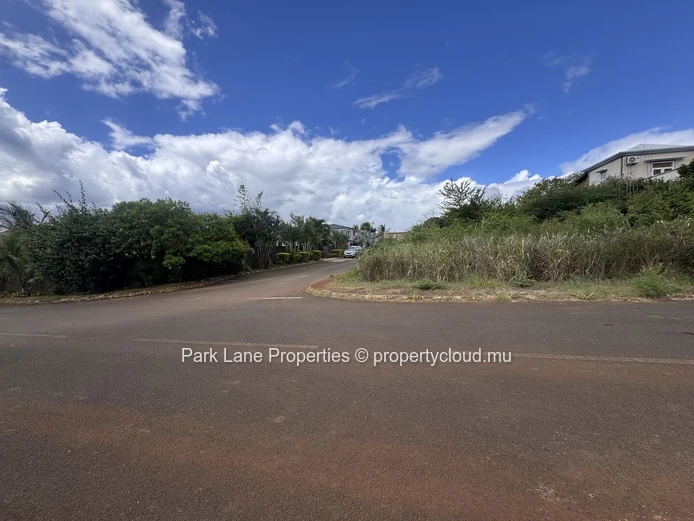 Land on corner in well established estate