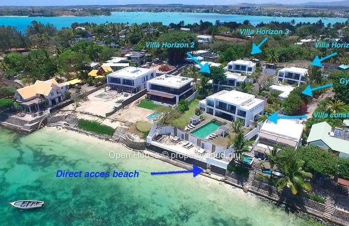 Contemporary villa facing the sea, with beach access, 3 ensuite bedrooms, swimming pool, and gym.