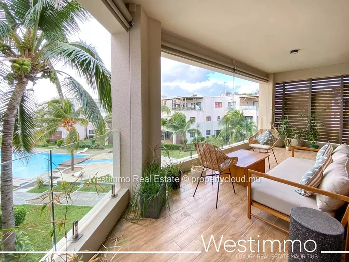 Flic en Flac - Luxueux appartement pieds dans l'eau avec piscine et vue sur le lagon.