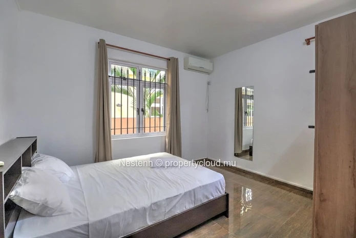 Spacious traditional triplex apartment in Grand Baie with 2 bedrooms, furnished, air conditioning, veranda, and close...