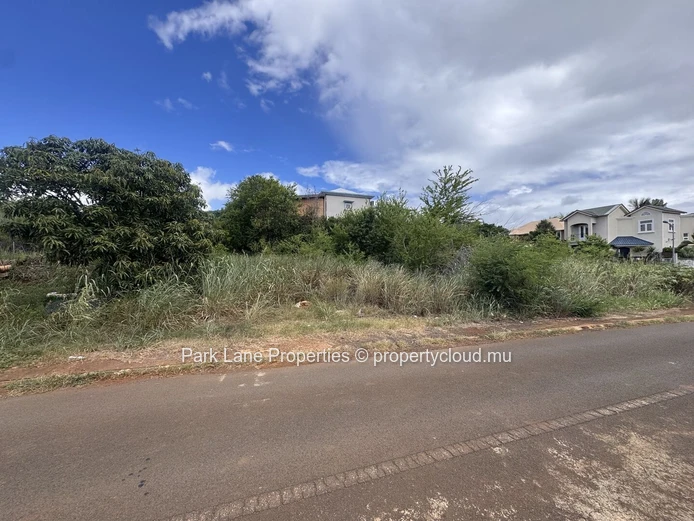 Land on corner in well established estate