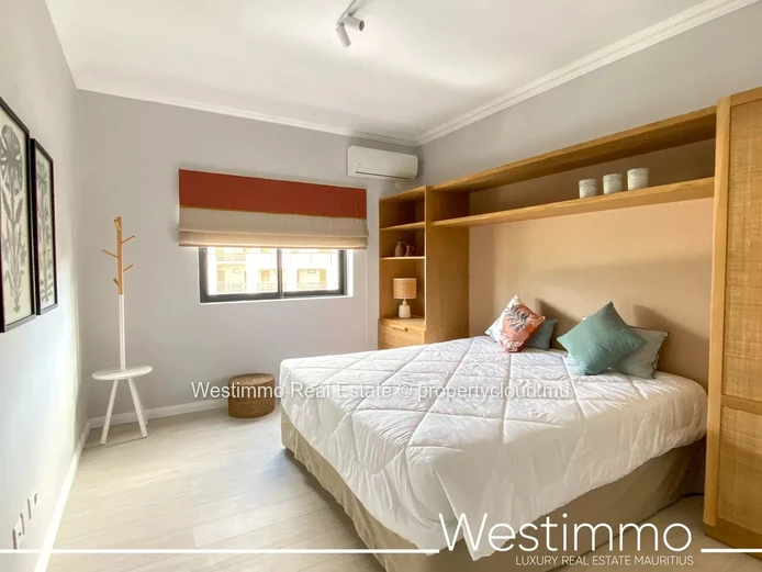 Flic en Flac - Luxueux appartement pieds dans l'eau avec piscine et vue sur le lagon.