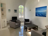 La Gaulette for sale villa divided into 4 two-bedroom apartments with commun swimming pool in a quiet residential area.