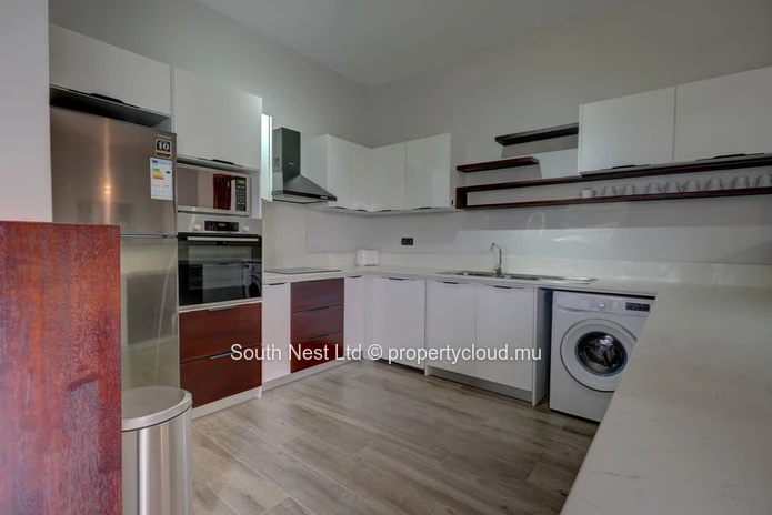 Elegant beachfront 3-bedroom apartment with private garden & direct beach access. 