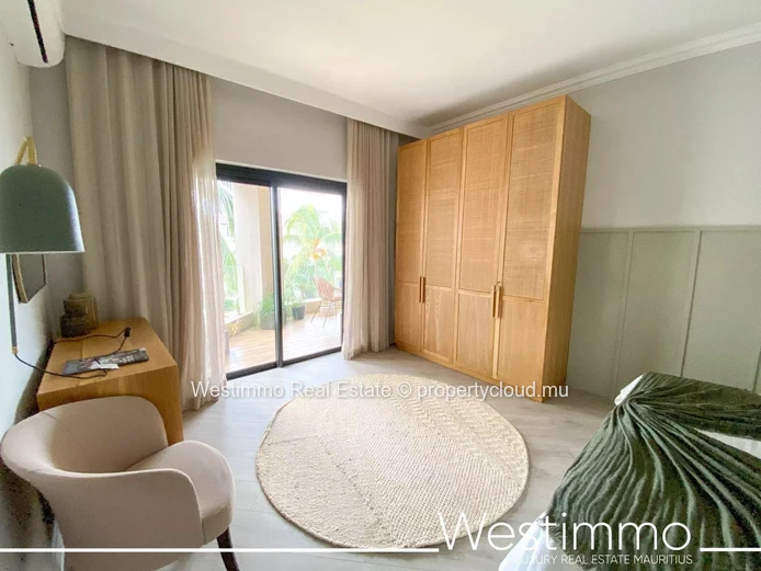 Flic en Flac - Luxueux appartement pieds dans l'eau avec piscine et vue sur le lagon.
