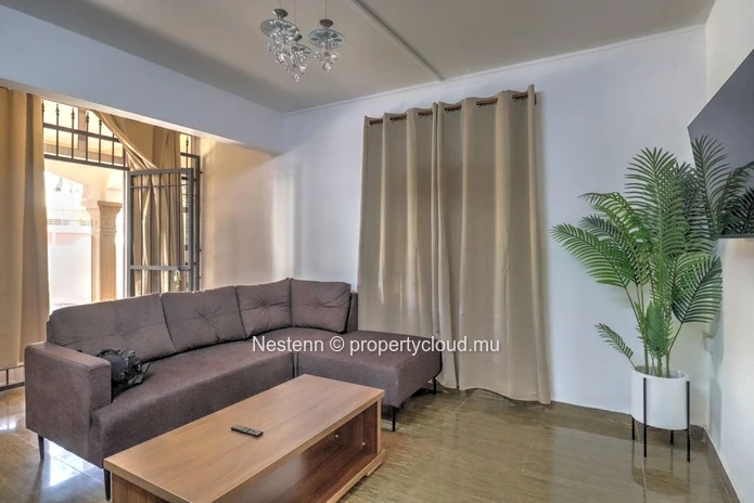 Spacious traditional triplex apartment in Grand Baie with 2 bedrooms, furnished, air conditioning, veranda, and close...