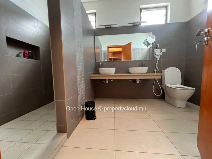 Architect-designed villa in Mon Choisy, featuring 4 bedrooms, 3 bathrooms, 1 office, and a swimming pool.