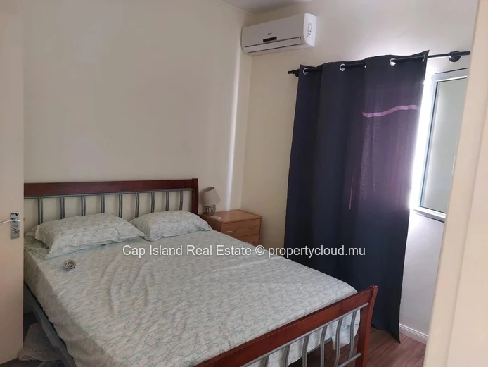 À Vendre – Élégant Triplex au Cœur de Grand Baie | Résidence Sécurisée avec Piscine