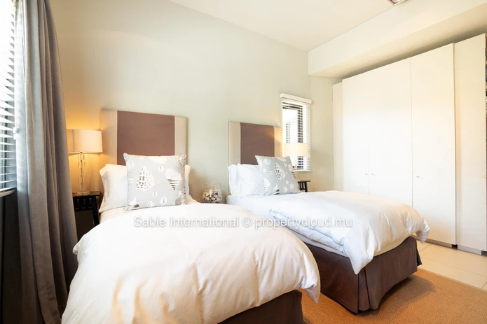 Luxurious Beachfront RES Apartment in Rivière Noire with stunning views and modern amenities. 4 bedrooms, sea access,...