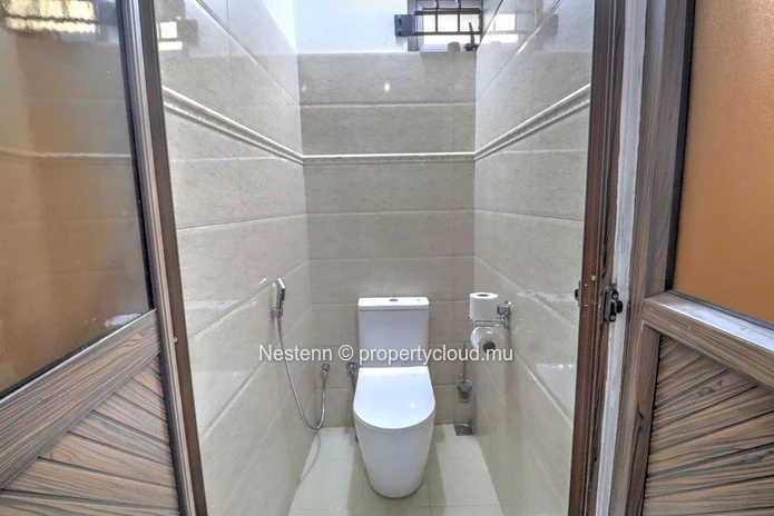 Spacious traditional triplex apartment in Grand Baie with 2 bedrooms, furnished, air conditioning, veranda, and close...