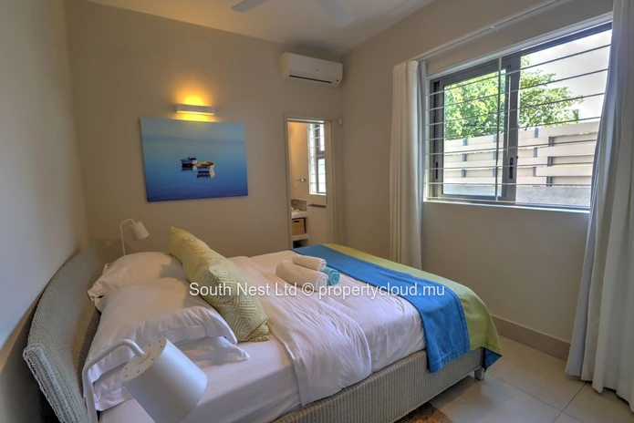 Modern 3-bed apartment with garden and private access to the beach of Pointe d'Esny.  