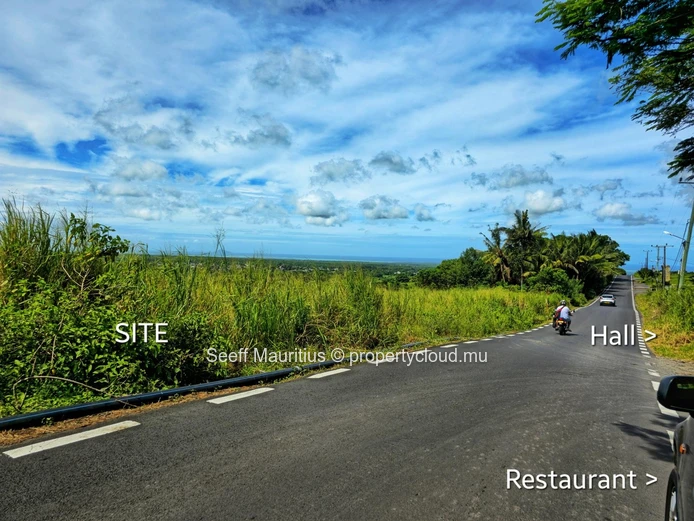 Golden Opportunity: Large Plot with Stunning Mountain and Sea Views, on the main road.
