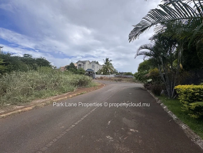 Land on corner in well established estate