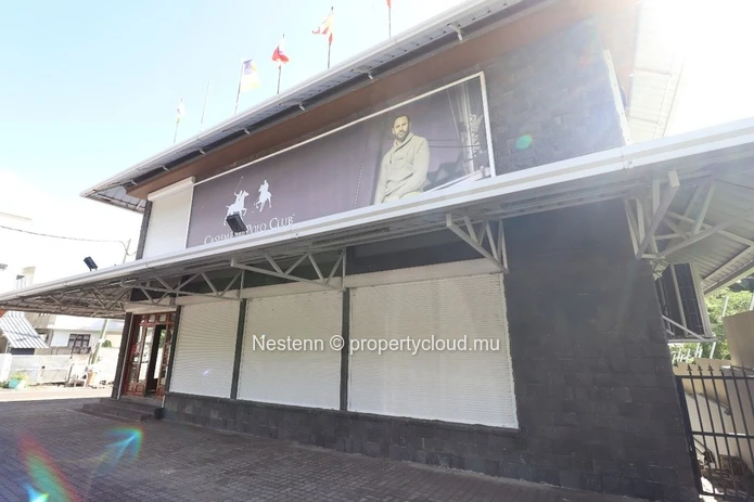 Commercial building with sea and mountain views.