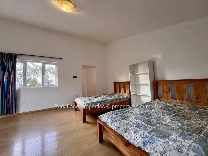 Double-storey home overlooking a magnificent pool and mature trees in Floreal